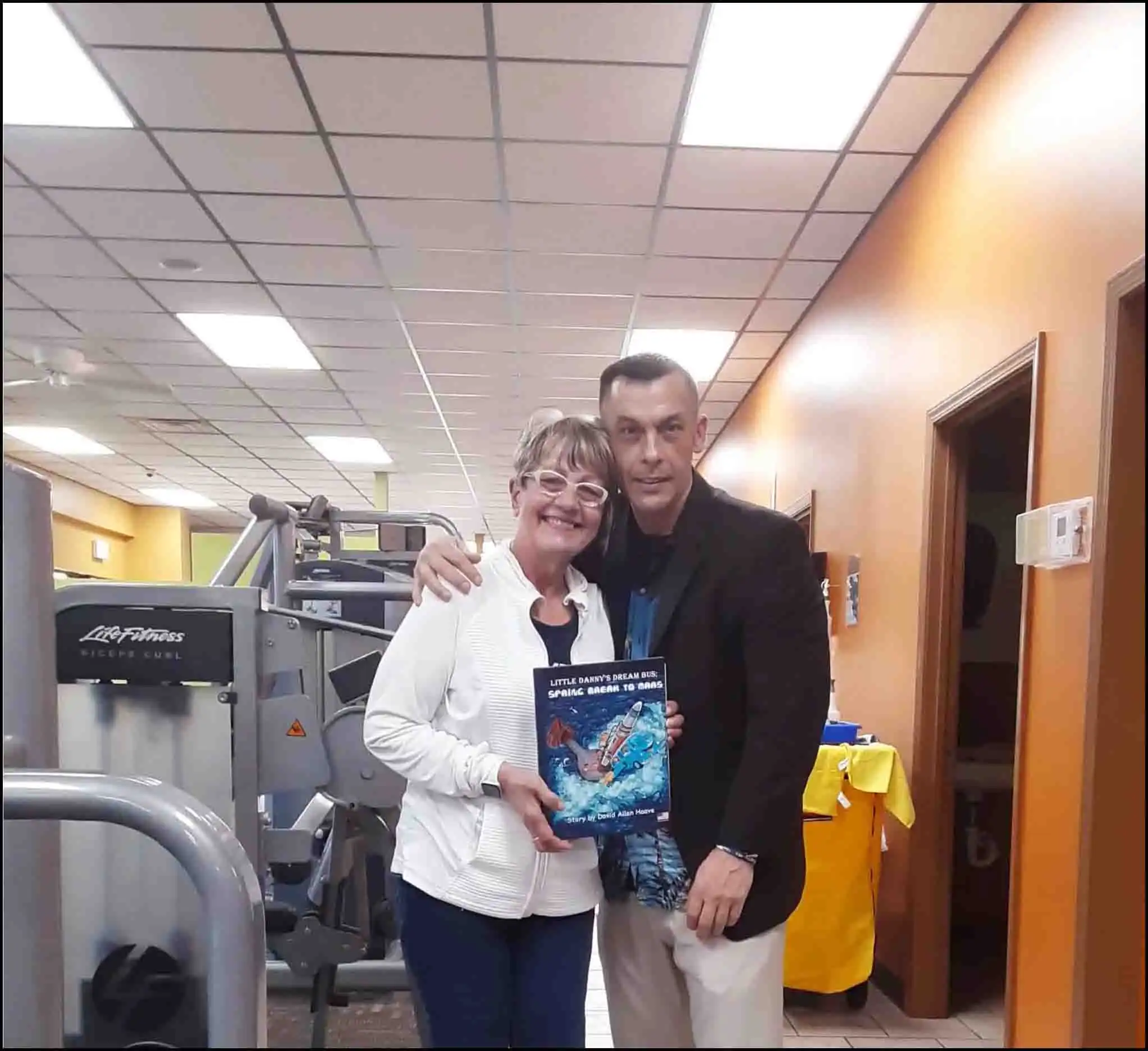 Book author David Haave signs Spring Break to Mars book for the gym community; Children's food drive program discussed with members -- David Haave